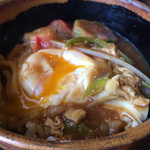 丸岡うどん - 丸岡うどん・味噌煮込みうどんのメーンイベント！
      ごはんに、半熟卵、味噌煮込みうどんの出汁を入れて、ガツガツっと食べる。
      最高の瞬間！