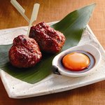 水たき料亭 博多華味鳥 - 特製たれつくね―自家製たれに付け焼いた「つくね」を生卵をつけお召し上がりください。