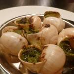 オステリア ブッコ - エスカルゴのオーブン焼　パセリバター　サンブーカ風味　１１００円