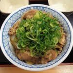Yoshinoya - 牛ネギ 玉丼 特盛 に、ネギの全部を載せます。