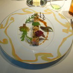 ロオジエ - フォワグラと青森県産シャモロックのテリーヌ　ヘーゼルナッツのオイルと春野菜を添えて。