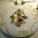 ロオジエ - フォワグラと青森県産シャモロックのテリーヌ　ヘーゼルナッツのオイルと春野菜を添えて。