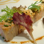 フォワグラと青森県産シャモロックのテリーヌ　ヘーゼルナッツのオイルと春野菜を添えて。