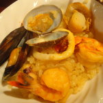 びすとろ UOKIN - 2010/05　シーフードパエリア　〆はこの１品！！ビストロ人気ＮＯ１(Ｍサイズ)(７８０円)・・・の取り分け後。