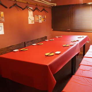 A private room with a table that can accommodate up to 26 people.