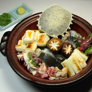 A craftsman with 20 years of experience in Japanese-style meal carefully examines the ingredients.