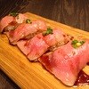 炭火焼肉 丑年 - 料理写真:限定！【A5常陸牛トモサンカクの炙り握り】(350円)