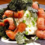 Adult potato salad topped with chorizo