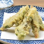 Deep-fried sardines wrapped in perilla leaves with matcha salt