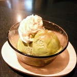 Matcha ice cream topped with brown sugar syrup and soybean flour