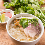 Vietnamese pho with chicken and aromatic vegetables