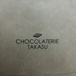 ショコラトリー タカス - 店名ロゴ