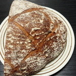 ブーランジェリー miki - 国産石臼挽き全粒粉100％の高加水パン(ハーフ243円)