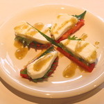 Caprese with tomatoes, perilla leaves and mozzarella cheese