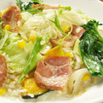 Cream risotto with thick-sliced bacon, cabbage, and corn