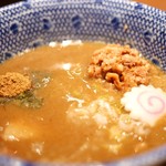 六厘舎 - 得製つけ麺スープ　魚粉・豚ほぐし　（メンマとチャーシューは沈んでいます）