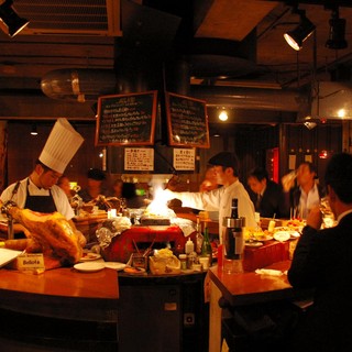 At the counter surrounded by charcoal. A lively atmosphere