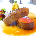 La Chevre d’Or - Milk-fed lamb,
            Grilled chop with black olive sauce.