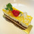プティグリオ - 料理写真:マンゴーのケーキ 390円
          チョコスポンジとマンゴーのムース？キラキラしてるのはレモンジュレかな。
