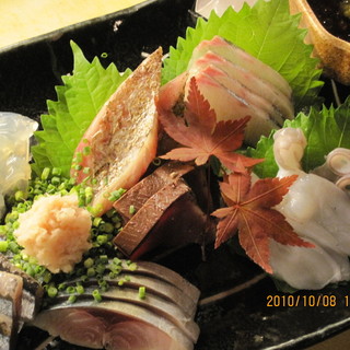 Start with the assorted sashimi!