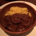 アベス - 烏賊の煮込みとサフランライス