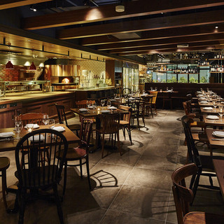 The main dining room has an impressive open kitchen.