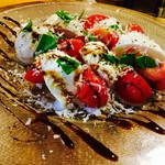 Caprese with buffalo mozzarella cheese and ripe tomatoes