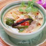 Coconut soup with chicken and herbs
