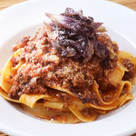 Handmade fettuccine with bolognese meat sauce and charred trevice accents