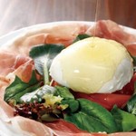 Caprese with whole burrata cheese and freshly cut Prosciutto