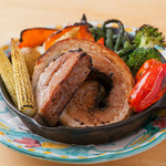 Oven-roasted thick-sliced porchetta and colorful vegetables