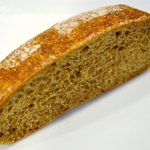 パンデュース - 国内産無農薬小麦「ミナミノカオリ」を低温長時間発光させて焼きあげた全粒粉１００％のパン　140円