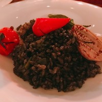 EX nishiazabu - イカ墨のパエリア。取り分けてくれました