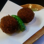 こなす - お通しのコロッケ