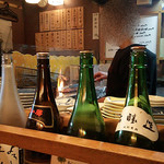 炉ばた　大謀 - 鹿肉を焼くママさん