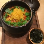 Earthenware pot rice with sakura shrimp and fava beans