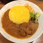 SPICY CURRY 魯珈 - 限定カレー 骨付きラムの辛口スープカレーのライス大盛