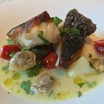 カーサ・デル・チーボ - 本日の鮮魚のインパデッラ 北海あさりとトマトのスープ仕立て（黒ソイ）