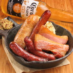 Grilled platter of 3 types of sausages and pancetta bacon