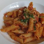 アブラッチョ - 魚介の煮込みとズッキーニのトマトクリームソースのペンネ