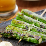 Thick asparagus skewers.