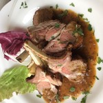 Charbroiled bone-in lamb with green pepper sauce