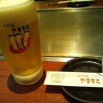 ねぎ焼やまもと - ビールグラスはお店のオリジナルグラス