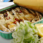 Oil sardines grilled over open flame
