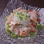 Caesar salad with organic vegetables and Prosciutto