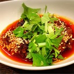 郷村居 - 北海道産タコの自家製ラー油漬け　750円。タコのこんな食べ方があるんですね。タコのカットがもう少し大きいのが好みです。