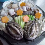 鮨・食の宿 丸仙 - 丸仙名物、海鮮の溶岩焼き。イカ、カキ、ホタテ、そしてアワビ。お好みの具材でどうぞ！