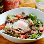 Caesar salad with grilled bacon and hot spring egg