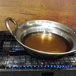 磯丸水産 - 鮪のハラミ鍋988円 鍋を火にかけてます