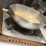 はらまさ - かに雑炊がお鍋に入っています